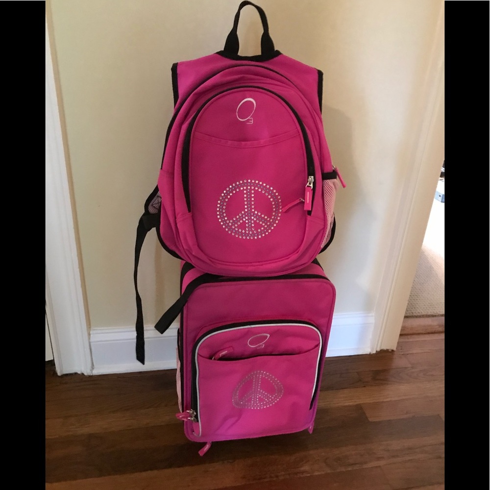 Small rolling suitcase with matching backpack